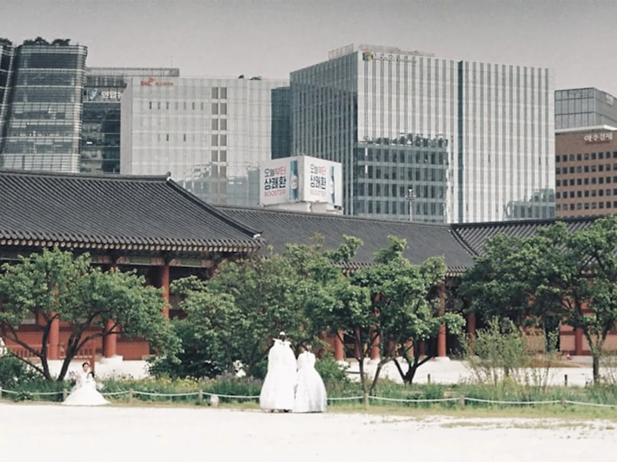 a group of people standing in front of a building