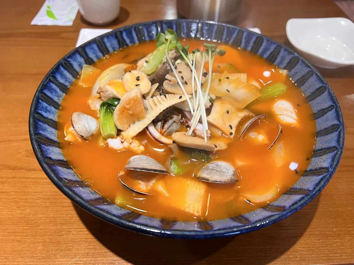 A bowl of soup related to Explore the vast world in Korea