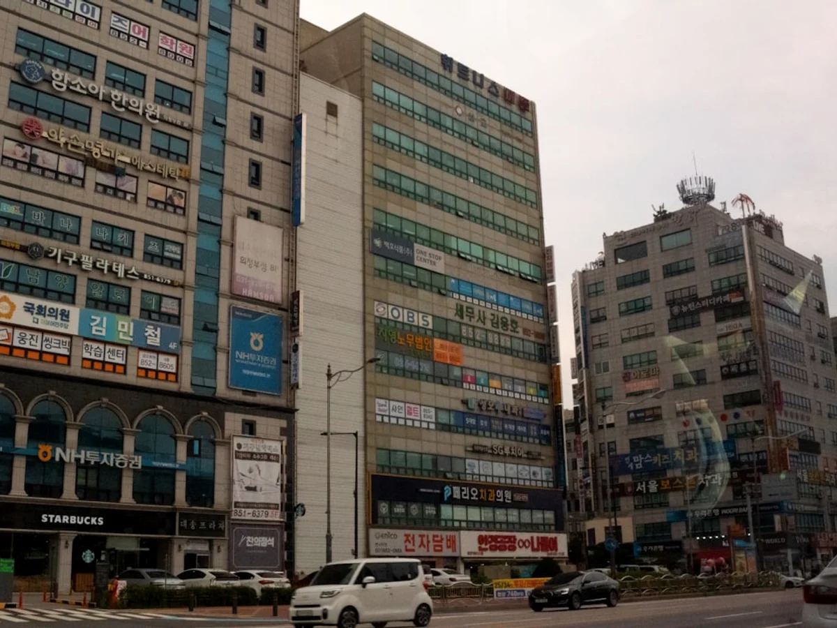 a street with cars and buildings on either side of it