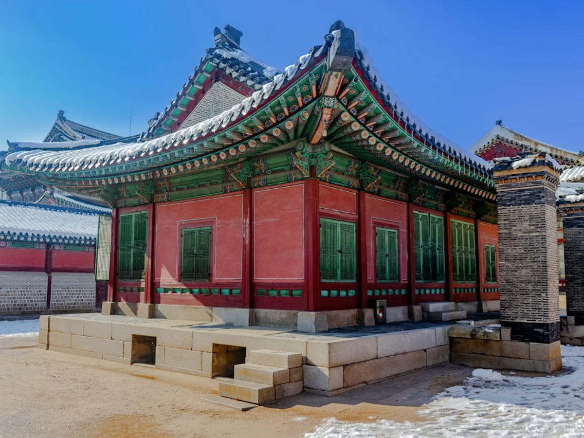 A golden buddha sits peacefully inside a temple. in Korea