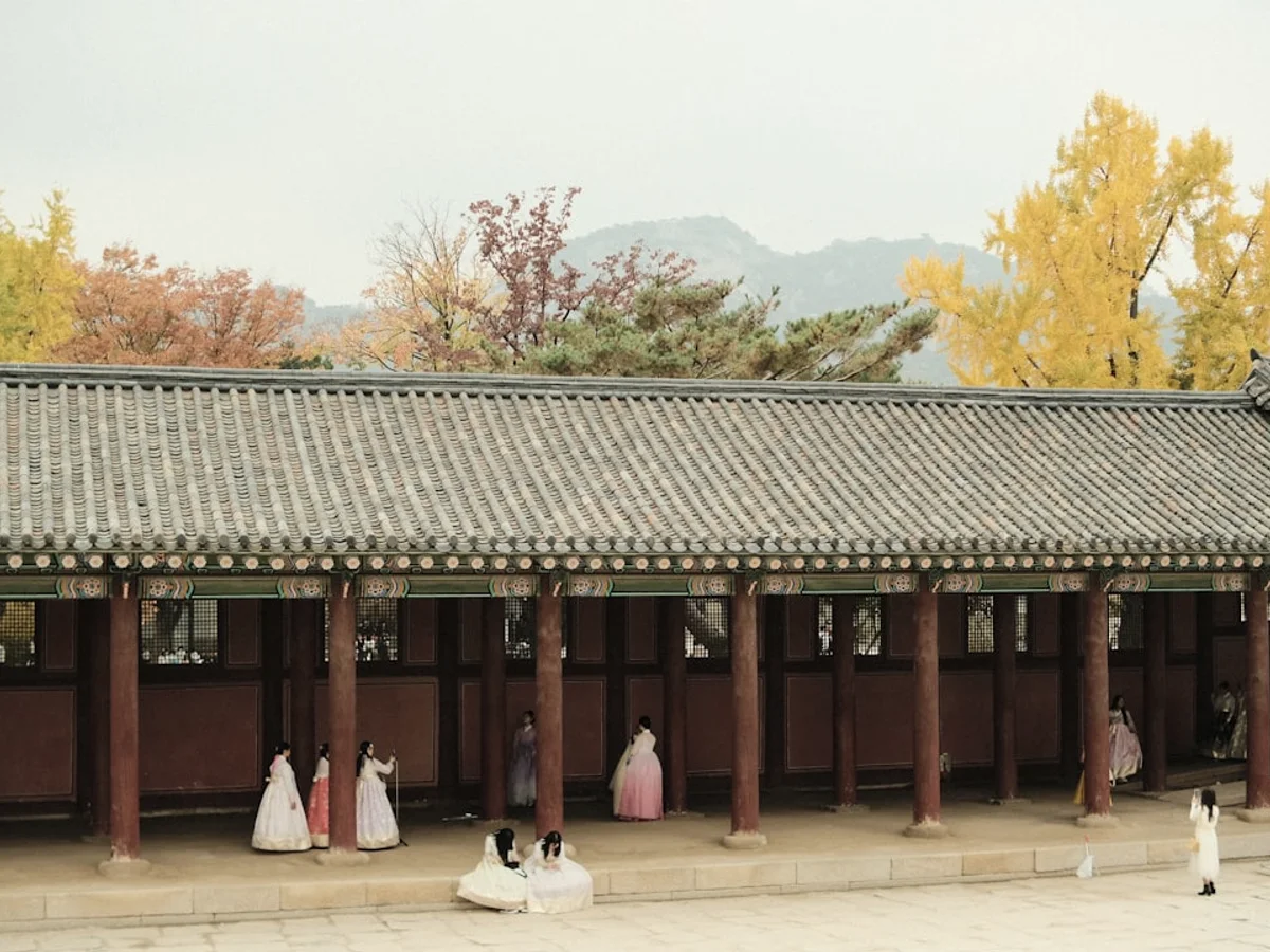 a group of people standing in front of a building