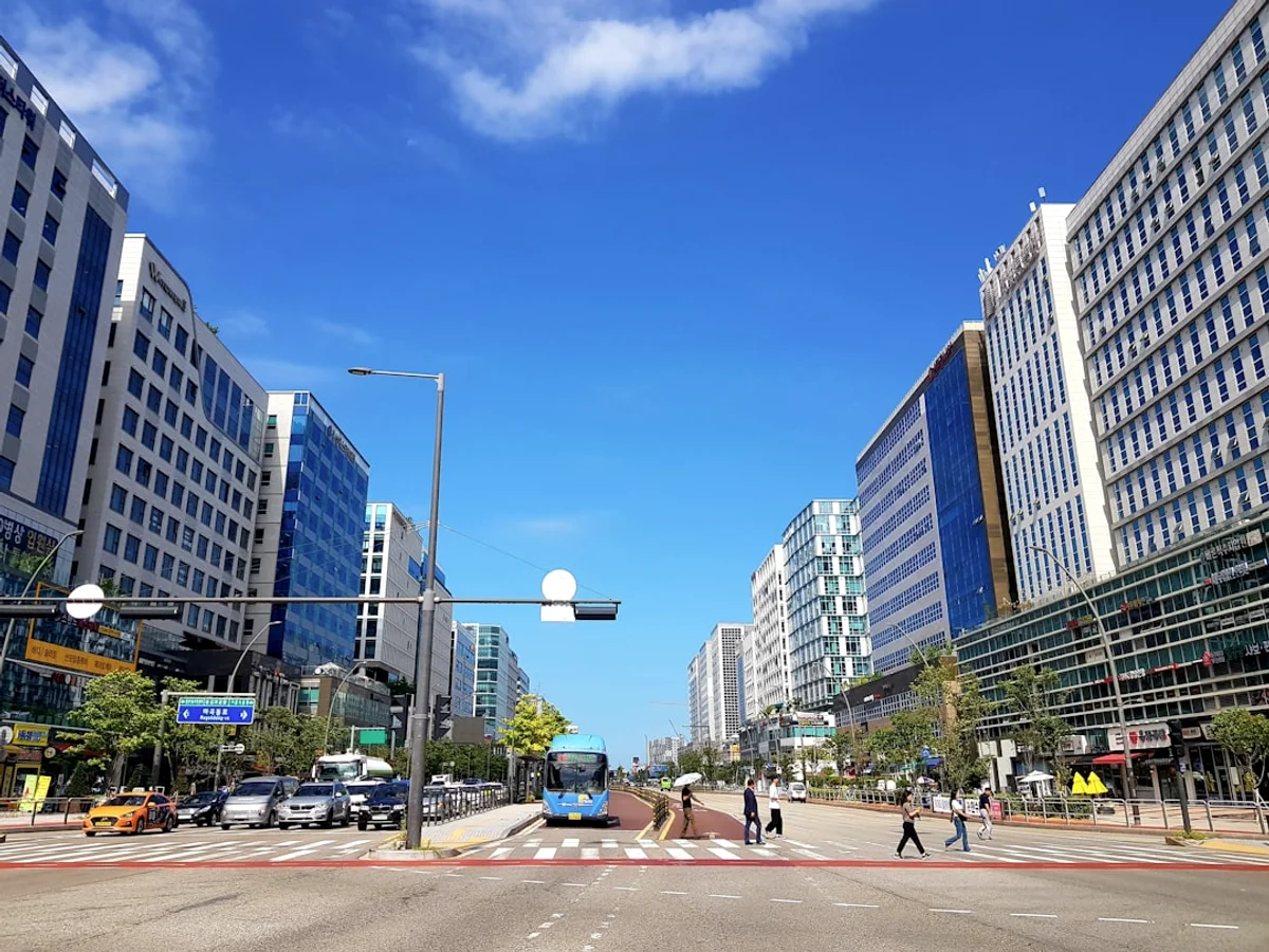 A city street filled with lots of tall buildings in Korea