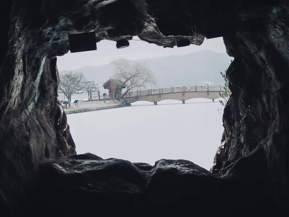 A view of a bridge from inside a cave in Korea