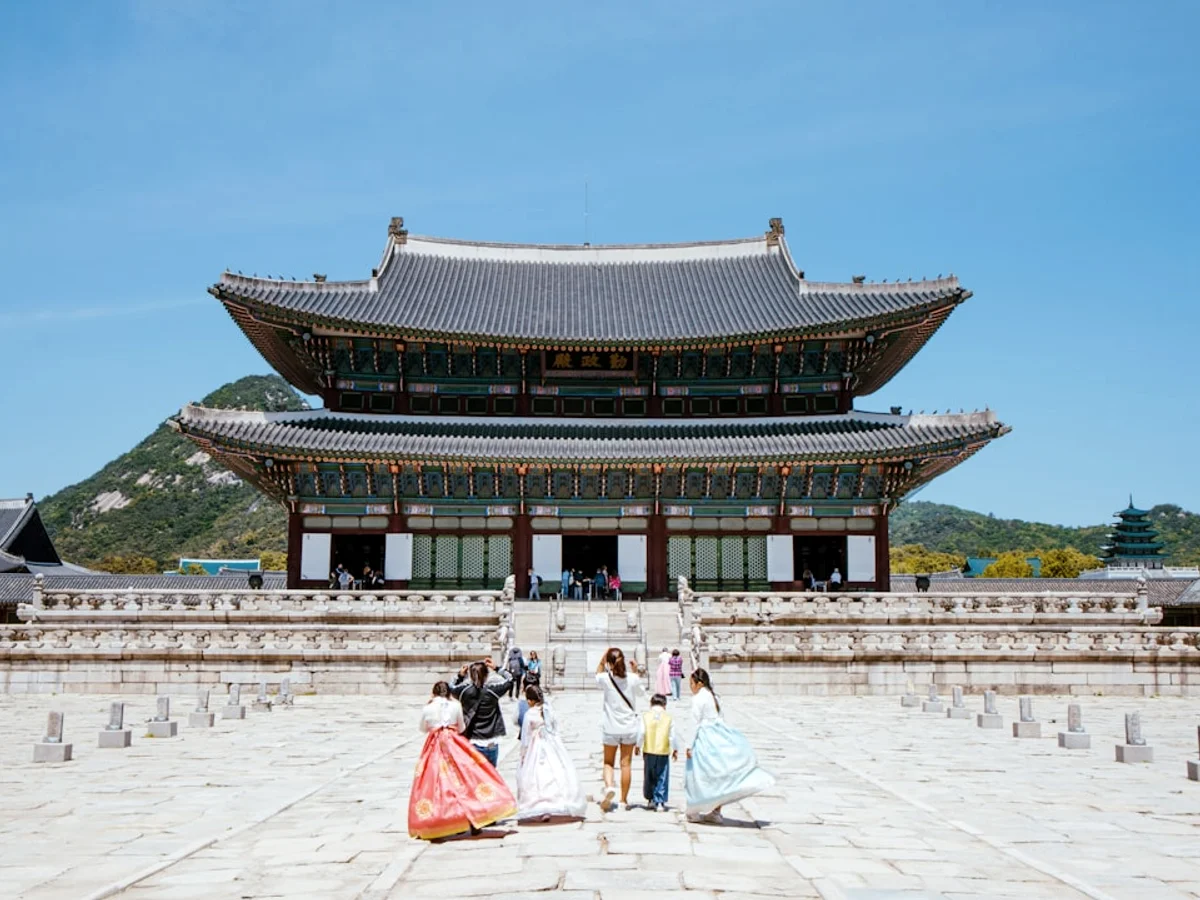 a group of people standing in front of a building