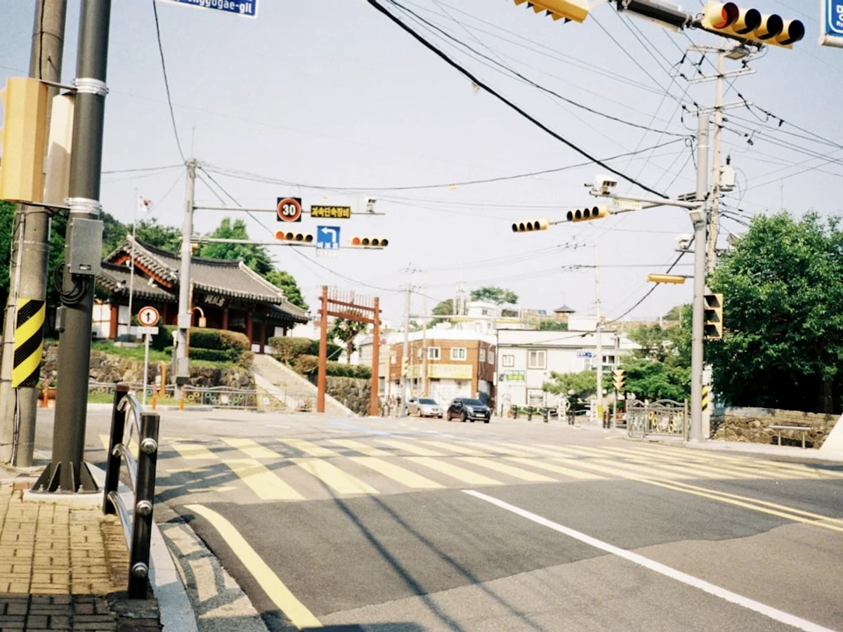 Street intersection with traffic lights and pedestrian crossing. in Korea